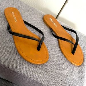 Black thong flip flops